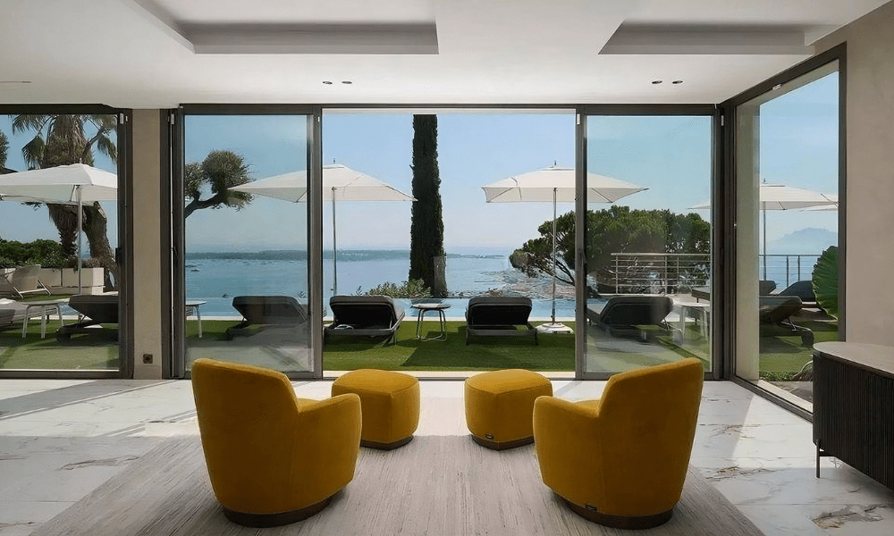 Villa Hotel Bassa Californie in Cannes, French Riviera, France – elegant living room with plush seating and panoramic windows